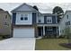 Charming two-story home features a two-car garage, stone accents, and welcoming front porch at 539 Slaty Dr., Myrtle Beach, SC 29588