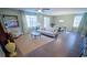 Bright living room and dining area featuring hardwood floors, modern décor, and lots of natural light at 539 Slaty Dr., Myrtle Beach, SC 29588