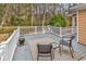 Relaxing back deck with seating area overlooking the wooded backyard at 540 Alderly Ct., Little River, SC 29566