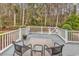 Enjoy the outdoors on this back deck with chairs and a view of the wooded backyard at 540 Alderly Ct., Little River, SC 29566