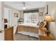 Inviting bedroom featuring neutral tones, woven furniture, and a cozy bed with plush pillows at 540 Alderly Ct., Little River, SC 29566