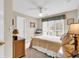 Cozy bedroom with neutral tones, ceiling fan, and large window providing natural light at 540 Alderly Ct., Little River, SC 29566