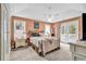 Sunlit bedroom featuring light walls, neutral furniture, carpet and access to the outdoors at 540 Alderly Ct., Little River, SC 29566