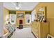 Bright bedroom with yellow walls, ceiling fan, and a dresser at 540 Alderly Ct., Little River, SC 29566