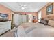 Spacious bedroom with en-suite bathroom, light walls, ceiling fan and carpet at 540 Alderly Ct., Little River, SC 29566