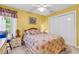 Welcoming bedroom featuring sunny walls, a double closet, and patterned floral bedding at 540 Alderly Ct., Little River, SC 29566