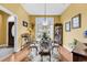 Inviting dining area featuring a glass table, stylish chairs, and large windows at 540 Alderly Ct., Little River, SC 29566