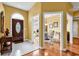 Welcoming foyer with hardwood and tile floors, showcasing access to the dining room at 540 Alderly Ct., Little River, SC 29566