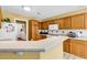 Functional kitchen with ample counter space, wood cabinets, and modern appliances at 540 Alderly Ct., Little River, SC 29566