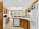 Kitchen with wood cabinets, a center island, and a view to a cozy breakfast nook at 540 Alderly Ct., Little River, SC 29566