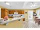 Well-equipped kitchen with wooden cabinetry, tile floors, and a breakfast bar at 540 Alderly Ct., Little River, SC 29566