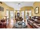 Spacious living room showcasing hardwood floors and open access to other rooms at 540 Alderly Ct., Little River, SC 29566