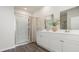Modern bathroom with double vanity, framed mirrors, and glass-enclosed shower at 559 Firouz Dr, Longs, SC 29568
