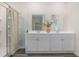 Bathroom featuring a double vanity and a shower with glass door at 559 Firouz Dr, Longs, SC 29568
