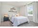 Comfortable bedroom with decorative shelves and cozy furnishings for relaxation and rest at 559 Firouz Dr, Longs, SC 29568