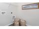 Clean laundry area with storage baskets and neutral paint, perfect for modern living at 559 Firouz Dr, Longs, SC 29568
