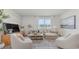 Bright living room with neutral decor, comfortable seating, and a large window, with tv at 559 Firouz Dr, Longs, SC 29568
