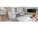 Cozy living room featuring plush seating, stylish decor, and ample natural light, open to the dining area at 559 Firouz Dr, Longs, SC 29568