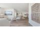 Open living room with natural light, wood floors, and modern decor offers a spacious and inviting ambiance at 559 Firouz Dr, Longs, SC 29568