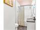 Bathroom featuring a single sink vanity, toilet, and shower/tub with a patterned shower curtain at 6001 - T33 South Kings Hwy., Myrtle Beach, SC 29575