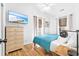 Bright bedroom with a dresser, flat-screen television, and two windows at 6001 - T33 South Kings Hwy., Myrtle Beach, SC 29575