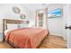Bright bedroom with a king bed, accent pillows, and a flat-screen television at 6001 - T33 South Kings Hwy., Myrtle Beach, SC 29575