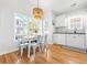 Bright breakfast nook boasts hardwood floors, white trim, lots of sunlight, and views of the kitchen at 6001 - T33 South Kings Hwy., Myrtle Beach, SC 29575