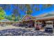 Exterior view of a casual dining spot with parked golf carts and patrons enjoying a sunny day at 6001 - T33 South Kings Hwy., Myrtle Beach, SC 29575