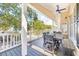 Inviting porch with ceiling fan, offering a relaxing space for outdoor dining at 6001 - T33 South Kings Hwy., Myrtle Beach, SC 29575