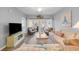 Relaxing living room with comfortable seating, a flat-screen TV, and access to an outdoor balcony at 601 N Hillside Dr. # 2235, North Myrtle Beach, SC 29582