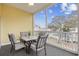 Relaxing screened patio features a dining table with seating and scenic neighborhood views at 601 N Hillside Dr. # 2235, North Myrtle Beach, SC 29582
