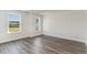 Well-lit bedroom with LVP flooring, base-molding and dual windows at 6011 Forest Dell Ct, Myrtle Beach, SC 29579
