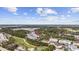 Spacious property with community, featuring a golf course and lush trees, as seen from an aerial view at 6015 Catalina Dr. # 914, North Myrtle Beach, SC 29582