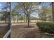 View from screened porch of landscaped grounds and walking path in backyard at 6015 Catalina Dr. # 914, North Myrtle Beach, SC 29582