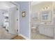 Bright bathroom features white fixtures and ample lighting, adjacent to the bedroom at 6015 Catalina Dr. # 914, North Myrtle Beach, SC 29582