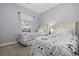 Bright bedroom features two twin beds and a window for natural light at 6015 Catalina Dr. # 914, North Myrtle Beach, SC 29582