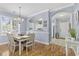 Cozy dining room with hardwood floors, chandelier, and a view of the kitchen at 6015 Catalina Dr. # 914, North Myrtle Beach, SC 29582