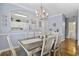 Inviting dining area with a modern chandelier and view into the kitchen at 6015 Catalina Dr. # 914, North Myrtle Beach, SC 29582