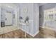 Entryway featuring tile and wood flooring with decorative table and access to other rooms at 6015 Catalina Dr. # 914, North Myrtle Beach, SC 29582