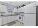 Bright kitchen with white cabinets, granite countertops, and modern appliances at 6015 Catalina Dr. # 914, North Myrtle Beach, SC 29582