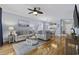 Open-concept living area with wood floors and adjacent dining area and kitchen at 6015 Catalina Dr. # 914, North Myrtle Beach, SC 29582