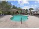 Inviting community pool surrounded by lush trees and plenty of space for lounging in the sun at 6015 Catalina Dr. # 914, North Myrtle Beach, SC 29582
