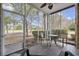 Relaxing screened porch with table and chairs for enjoying the outdoor scenery at 6015 Catalina Dr. # 914, North Myrtle Beach, SC 29582
