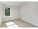Bright bedroom featuring a sunlit window and neutral carpeting at 6031 Forest Dell Ct, Myrtle Beach, SC 29579
