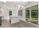 Open dining area with modern chandelier and sliding glass doors leading to an outdoor patio at 6031 Forest Dell Ct, Myrtle Beach, SC 29579