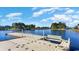 Scenic view of a wooden dock on a tranquil lake surrounded by trees at 6031 Forest Dell Ct, Myrtle Beach, SC 29579