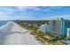 Stunning aerial view of beachfront condo resort, pool area, ocean views, and a wide sandy beach at 6804 N Ocean Blvd. # 1639, Myrtle Beach, SC 29572