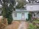 Charming exterior view of house number 7 with muted green siding and cozy front yard at 7 Century St. # 7, Myrtle Beach, SC 29577