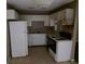 Functional kitchen features basic appliances, ample cabinet space, and tile flooring at 7 Century St. # 7, Myrtle Beach, SC 29577