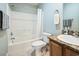 Clean bathroom featuring a bathtub-shower combo, toilet, vanity with granite countertop, and tile flooring at 705 Beach Walk Pl. # 705, Myrtle Beach, SC 29577